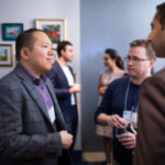 3 Consultants discussing at a Networking event