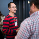 Man with stripe shirt networking
